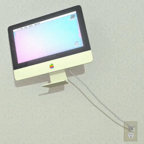 Apple Computer Plugged Into Wall Outlet