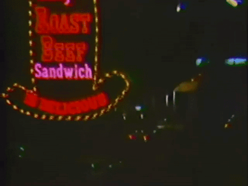 Arby's Roast Beef Sandwich Sign Lit Up at Night