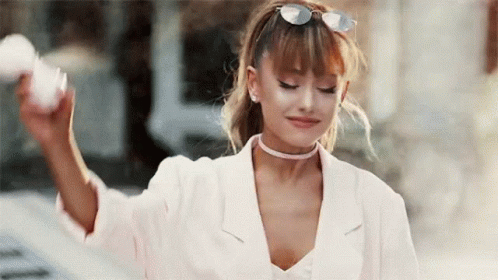 Ariana Grande in Choker and Sunglasses Holding Cotton Candy