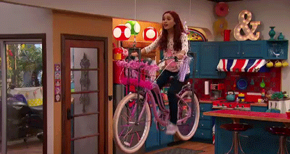Ariana Grande Riding Cycle GIF