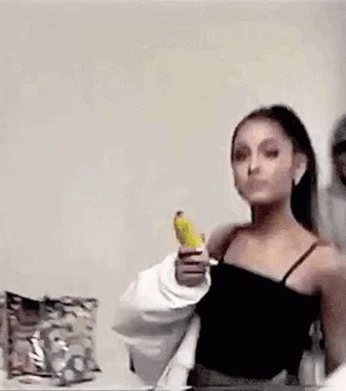 Ariana Grande Showing Bread Knife GIF