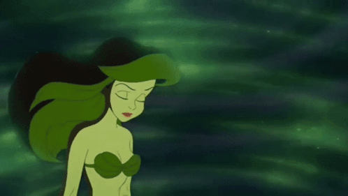 Ariel From The Little Mermaid Has Green Hair And A Green Light Coming Out Of Her Mouth . GIF