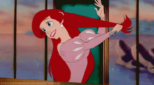 Ariel From The Little Mermaid Is Brushing Her Hair With A Comb GIF