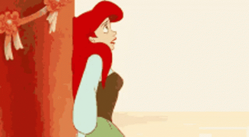 Ariel From The Little Mermaid Is Peeking Out From Behind A Tree GIF