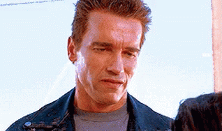 Arnold Schwarzenegger Annoyed Smile GIF