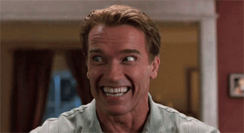 Arnold Schwarzenegger Is Smiling With His Mouth Open GIF