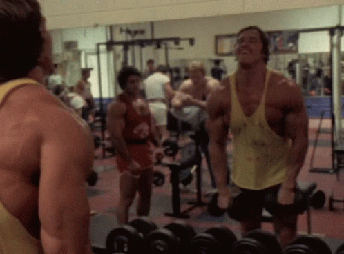 Arnold Schwarzenegger Lifting Dumbbell GIF