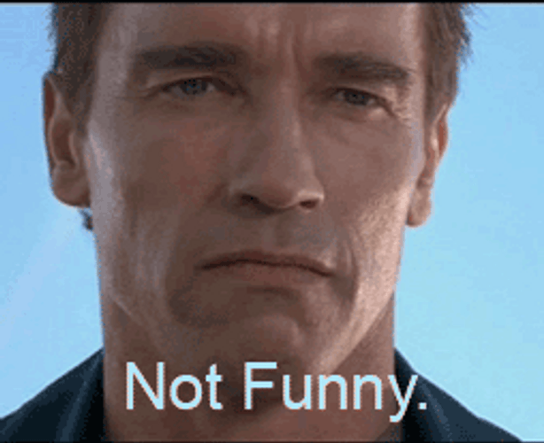 Arnold Schwarzenegger Not Funny Smiling To Serious Look GIF