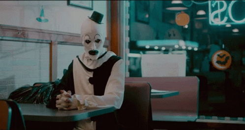 Art The Clown Smile Then Serious GIF