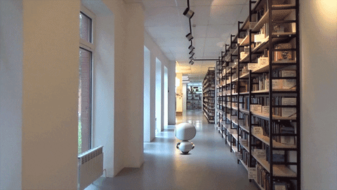 Artificial Intelligence Robot In Library GIF
