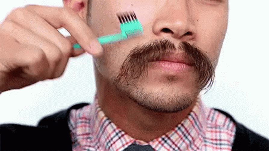 Asian Guy Combing His Mustache GIF