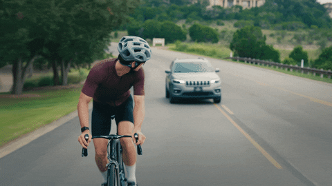 Athlete Biking In Open Roads GIF