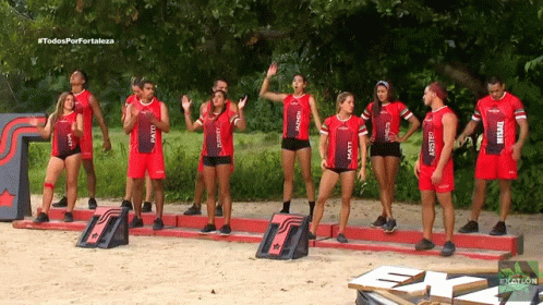 Athletes in Red Uniforms With Matt