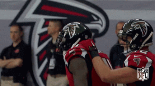 Atlanta Falcons Football Players Hugging NFL Logo GIF