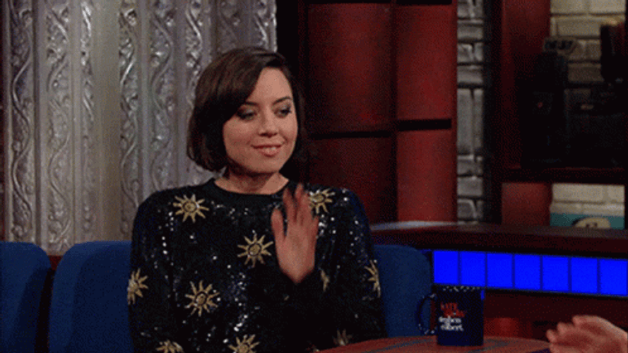 Aubrey Plaza Leaning And Listening To Someone GIF