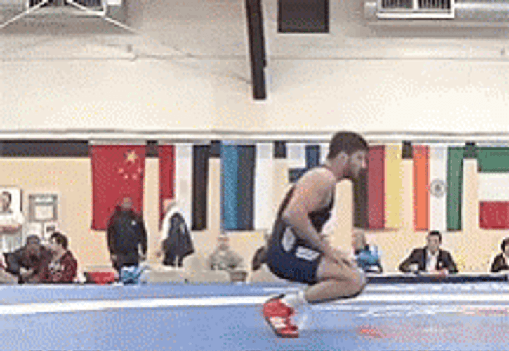 Awkward Bend Over Wrestling Match Pose GIF