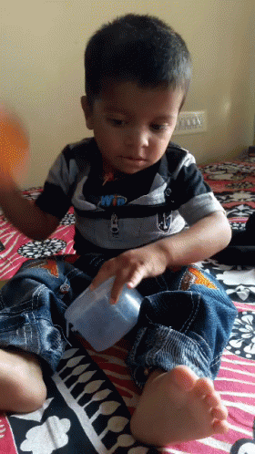 Baby Boy Puts Powder GIF