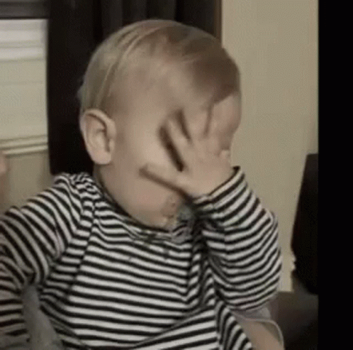 Baby Covering His Face