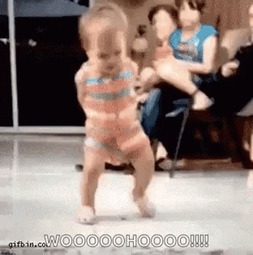 Baby Dancing on Dance Floor in Front of Crowd