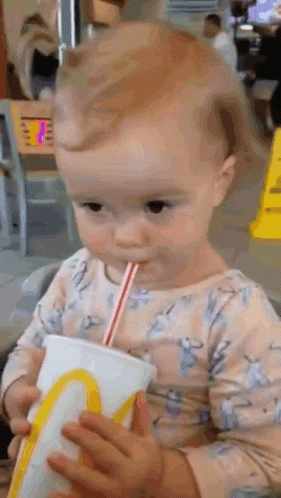 Baby Drinking From McDonald's Cup With Straw
