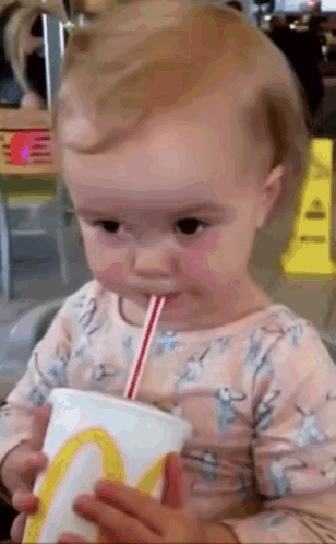 Baby Drinking From McDonald's Cup With Straw GIF