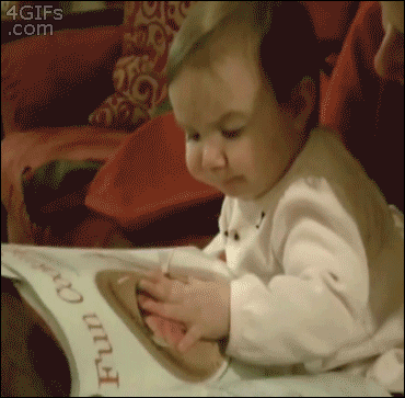 Baby Eating Cookies From Magazine GIF