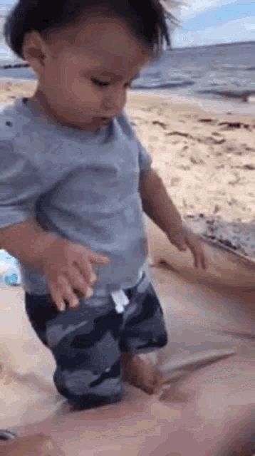 Baby Enjoying The Beach GIF