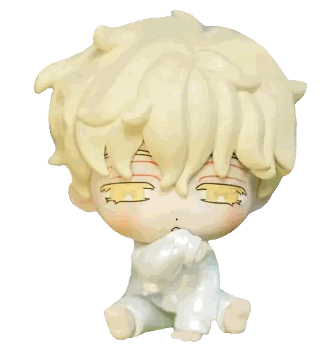 Baby Figurine with Yellow Hair and White Clothes