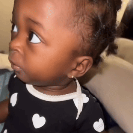 Baby Girl In Polka Dot Shirt With Hearts GIF
