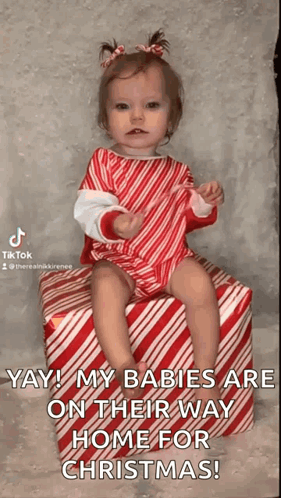 Baby Girl Sitting on Candy Cane Gift