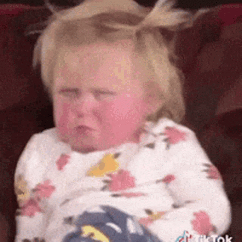 Baby Girl Sitting On Couch Crying GIF