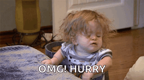 Baby Girl Sitting On Couch Making Funny Face Saying OMG Hurry GIF