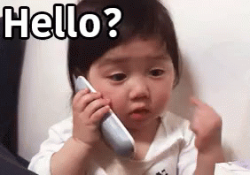 Baby Girl Talking on Cell Phone Making Funny Face