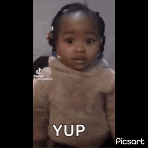 Baby Girl With Headphones Making Funny Face Saying Yup GIF