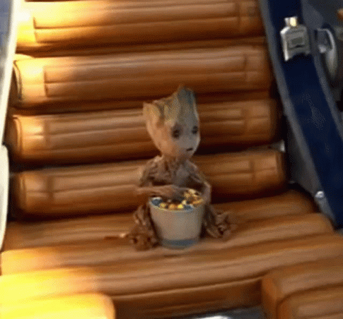 Baby Groot Digging On Skittles Candy GIF