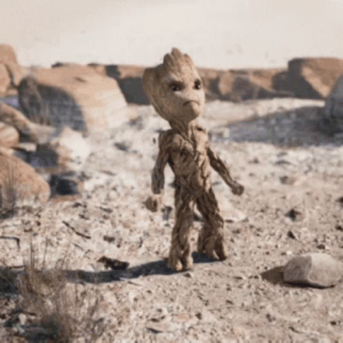 Baby Groot From Guardians Of The Galaxy Standing In Desert GIF
