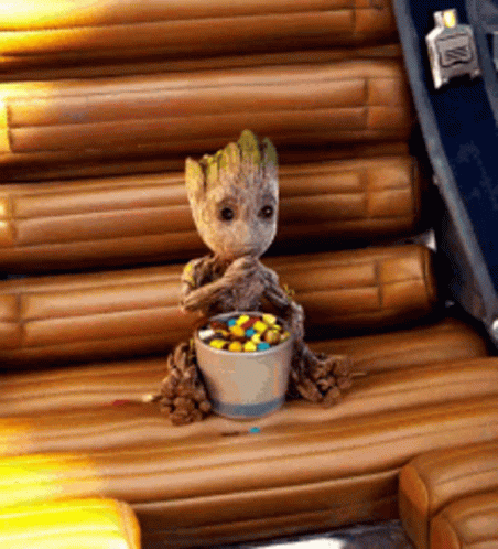 Baby Groot Sitting in Chair with Candy