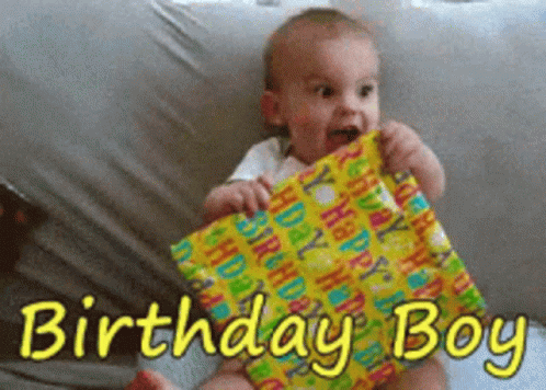 Baby Holding Birthday Present