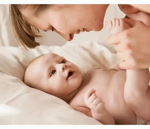 Baby Holding Birthday Present Saying Happy Birthday