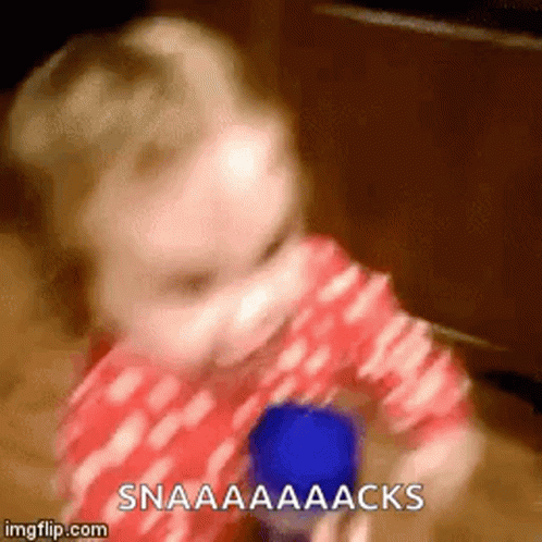 Baby Holding Blue Cup Saying Snaaaaacks