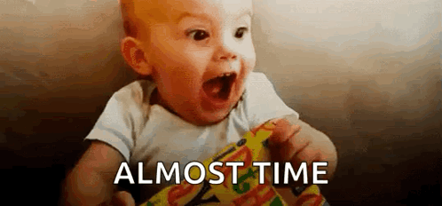 Baby Holding Candy Bar Saying Almost Time