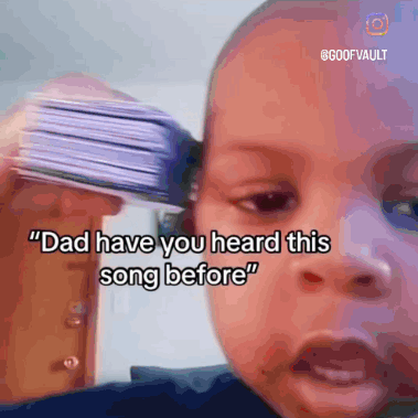 Baby Holding Cards to Ear Says Dad Have You Heard This Song Before