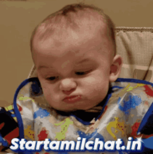 Baby In Bib In High Chair With Starttamilchat.in GIF