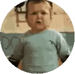 Baby in Blue Shirt Standing in Circle with Do
