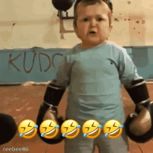 Baby in Boxing Gloves Before Kudc Sign
