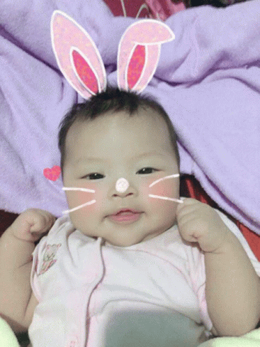 Baby In Bunny Ears And Cat Face Mask GIF