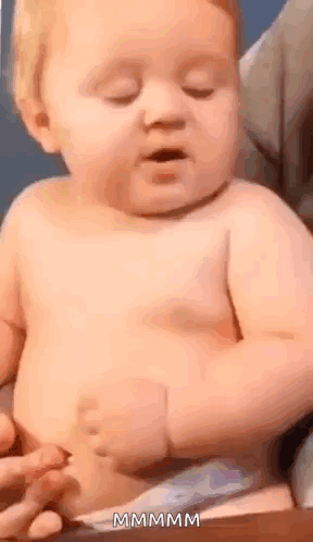 Baby in Diaper Sitting with Eyes Closed