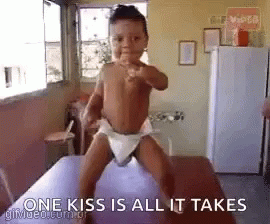 Baby In Diaper Standing On Table