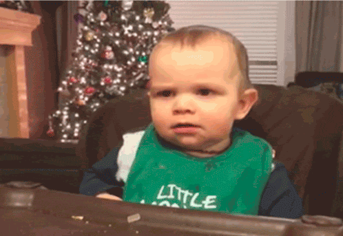 Baby in Green Bib Says Little
