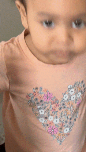 Baby in Pink Shirt With Heart